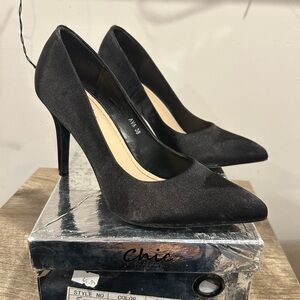 Black satin pumps